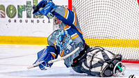 A Sheffield Steelkings Para Ice Hockey Club player defends the goal on the ice rink.