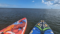 Two paddleboard tips on the water