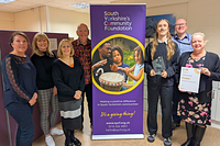 SYCF celebrating awards double