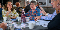 image of Ruth Willis the CEO and Allison Wade smiling on a table