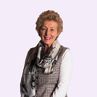 A head and shoulders photo of a smiling woman